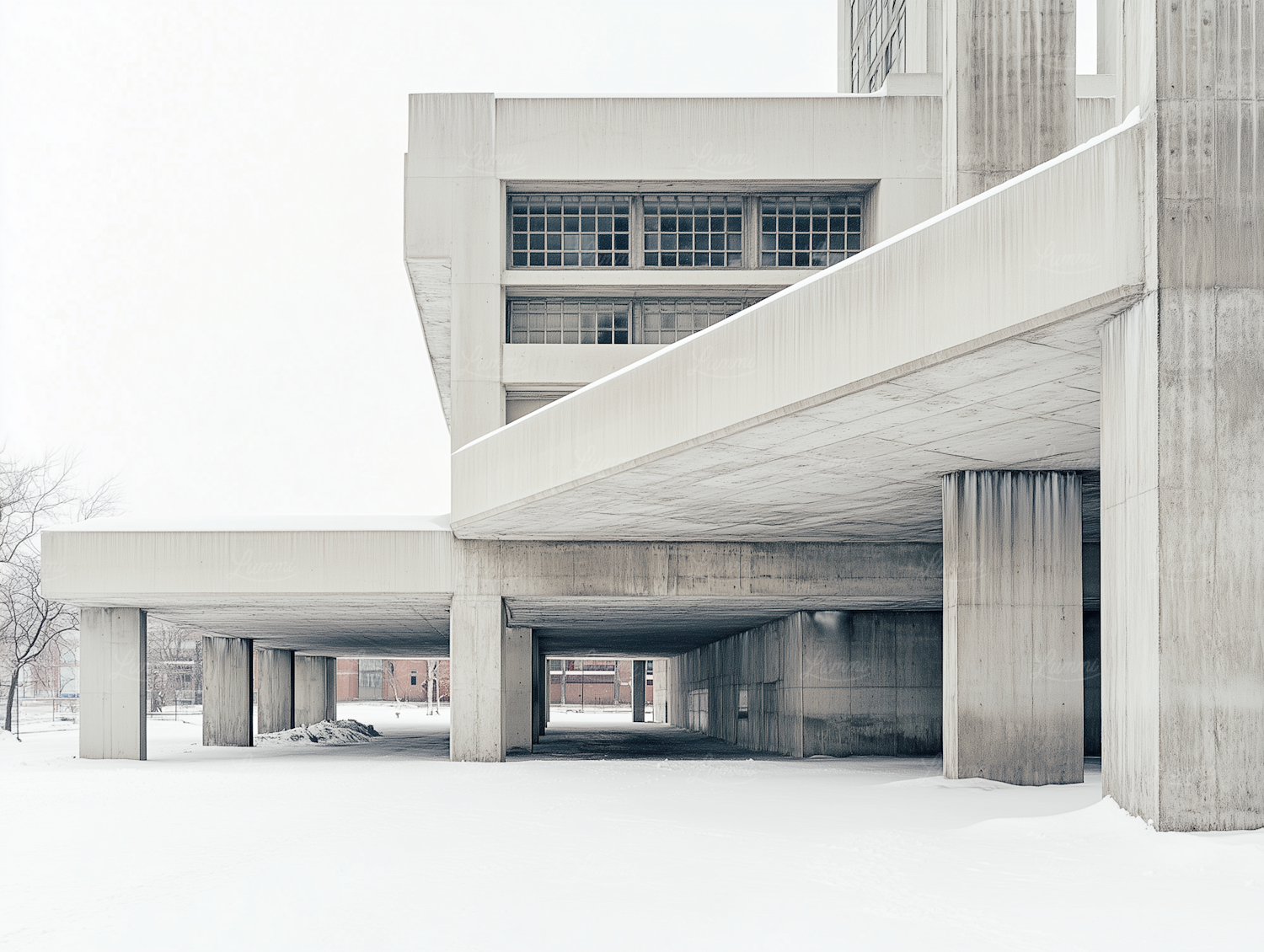 Brutalist concrete building standing alone in a bare snow-covered landscape